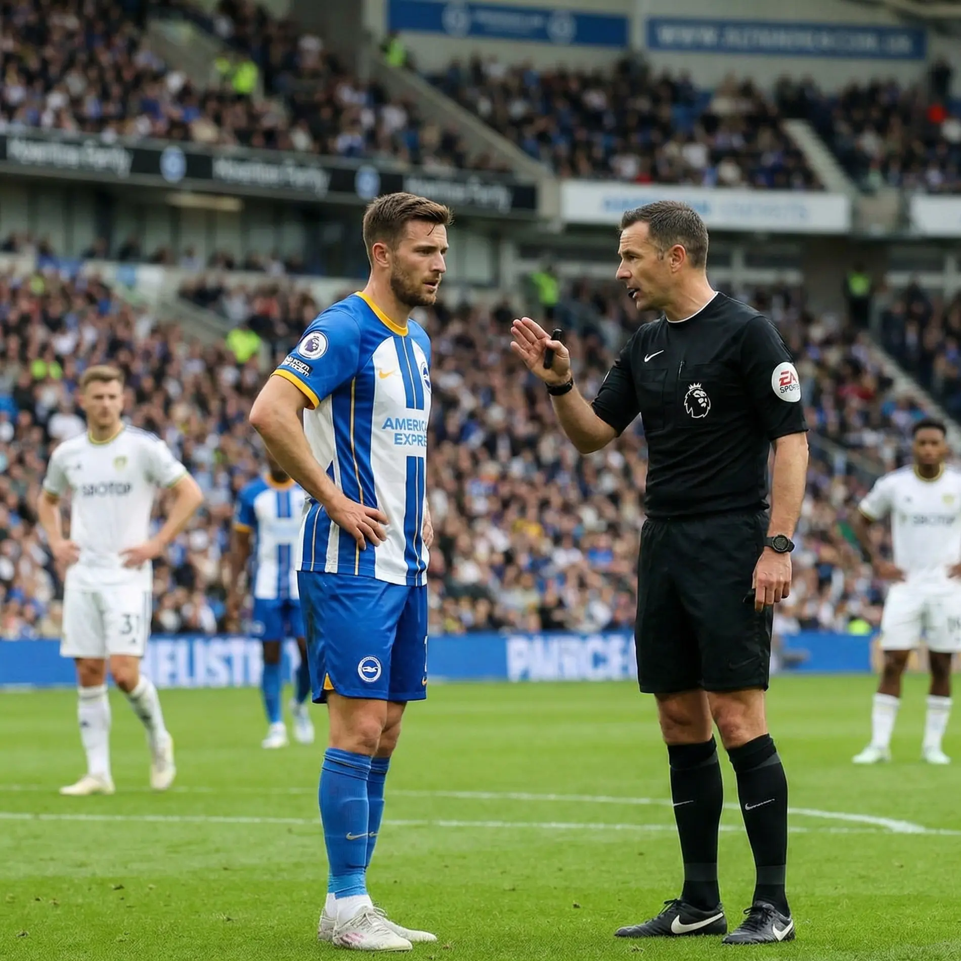 Referee speaking to midfielder after foul in centre of pitch